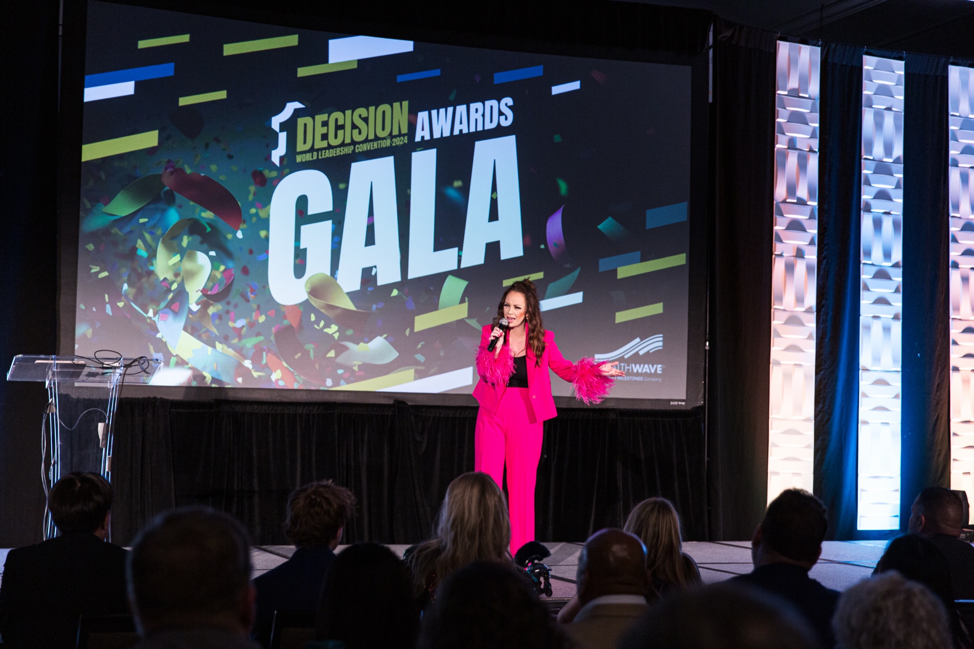 Josh Littauer's wife Morgan speaking at the WealthWave Decision Awards Gala