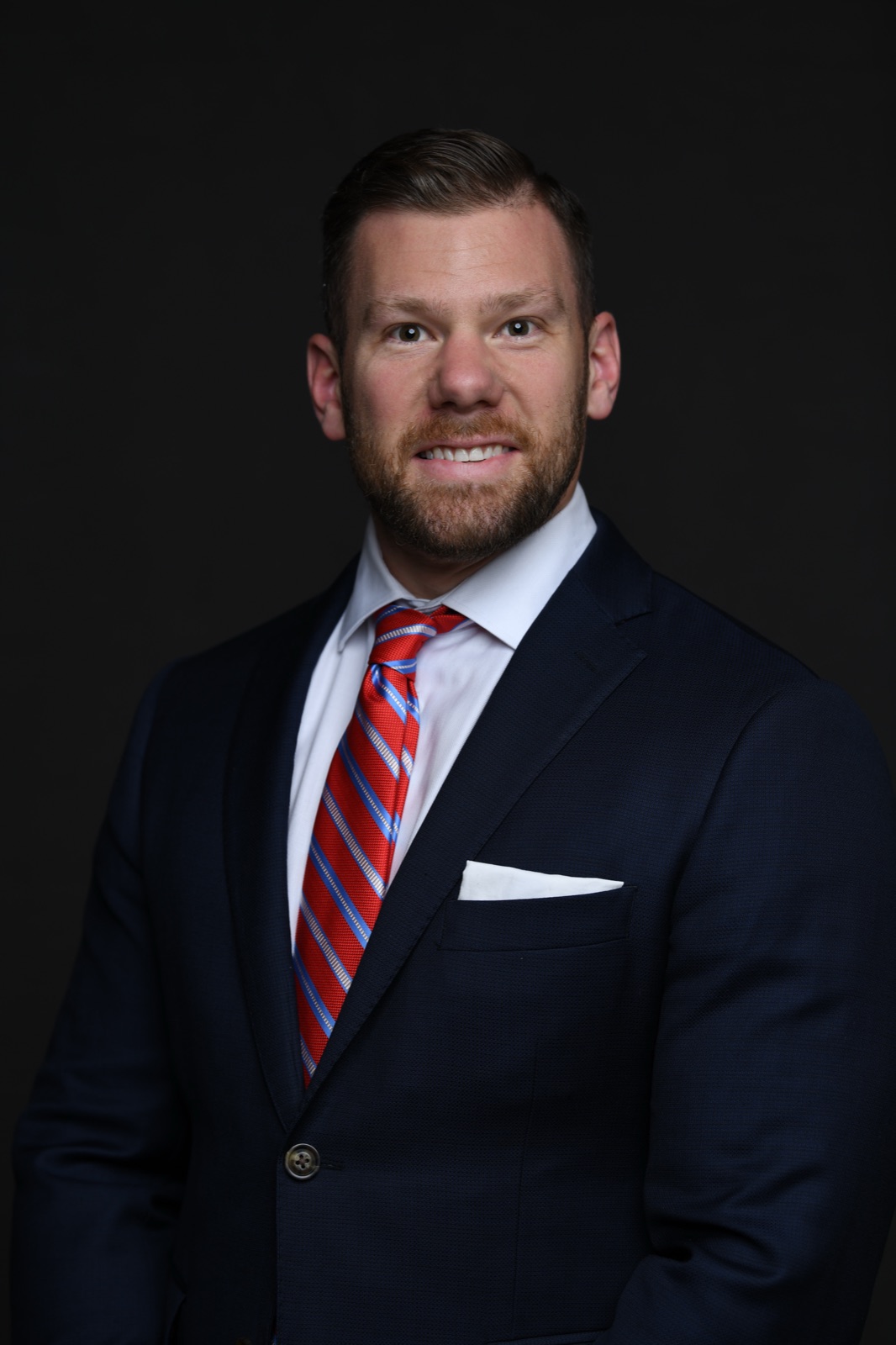Josh Littauer, financial educator in Dallas-Fort Worth, in a navy suit
