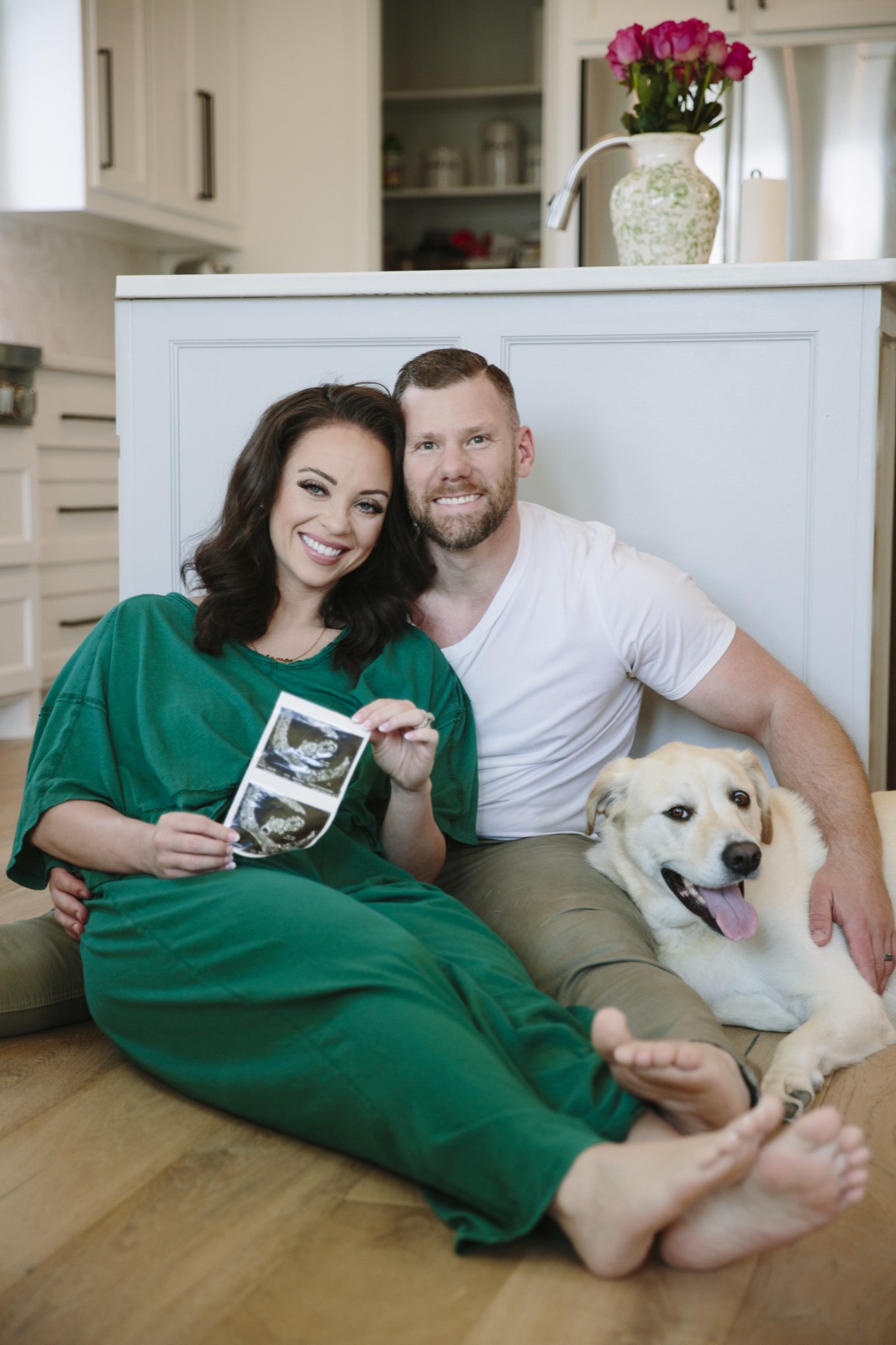 Josh Littauer with his wife Morgan and their dog Poppie at home in their kitchen